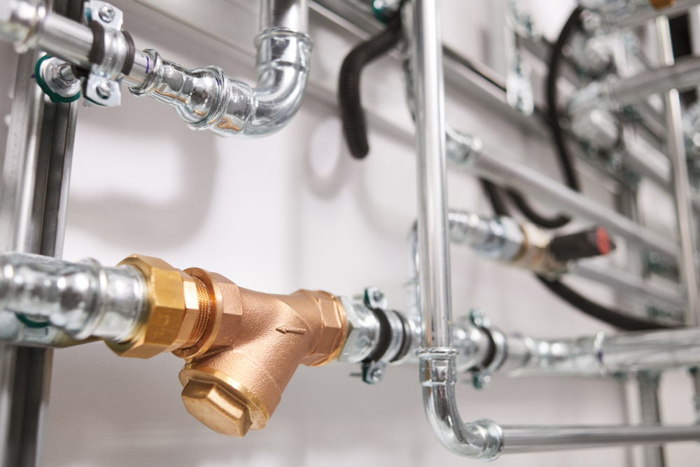 Plumbing,Service.,Stainless,Steel,Pipeline,Of,A,Heating,System,In