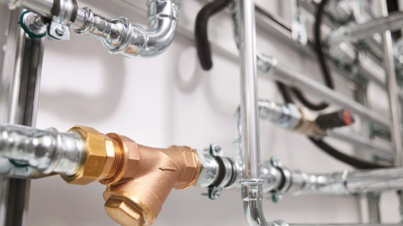 Plumbing,Service.,Stainless,Steel,Pipeline,Of,A,Heating,System,In Plumbing,Service.,Stainless,Steel,Pipeline,Of,A,Heating,System,In
